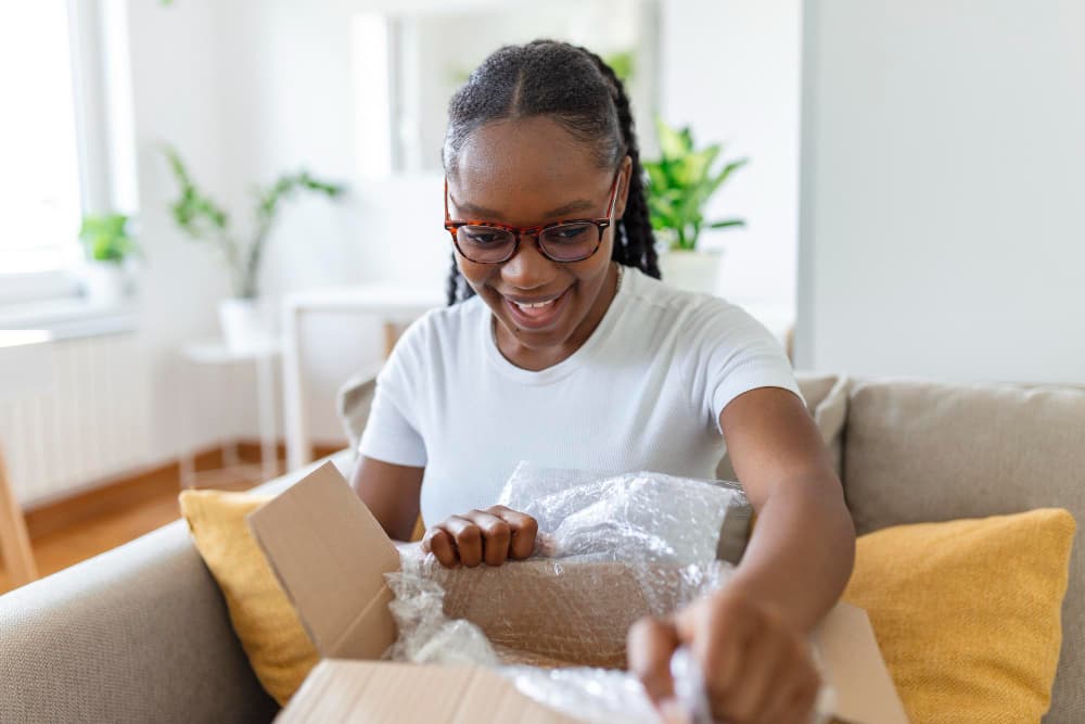 A happy customer opening a package